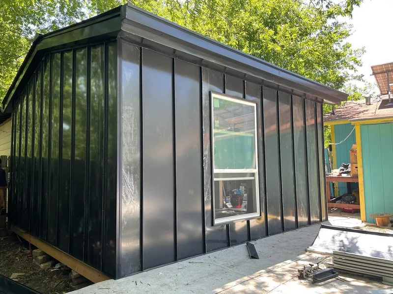 Black standing seam metal wall panels for Roof Inspection in North Hills